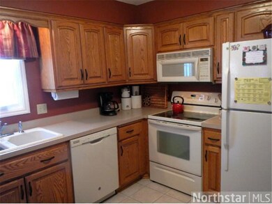 Oak cabinetry, glass top electric range and great 