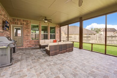 Enjoy the backyard with this large screened in por