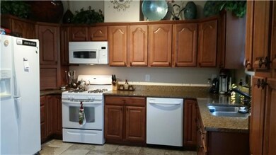 Kitchen has custom cabinets, granite counter tops and more!