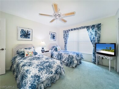 Bedroom with carpet and ceiling fan