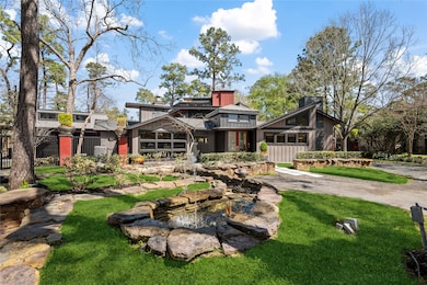 Front of the home is professionally landscaped wit