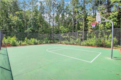 View of sport court featuring community basketball court