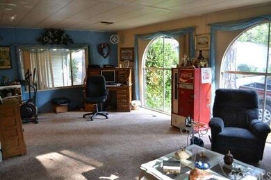 Roomy living area with views of the neighborhood.