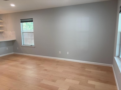 Unfurnished room featuring light wood-style floor