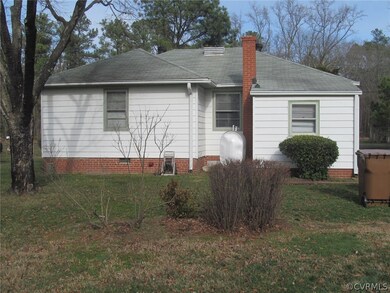 Rear view of well maintained home