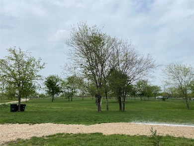 View of community featuring a yard