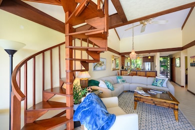 The spiral staircase to the loft area has been updated to wood and gives an upscale feel to the condo.