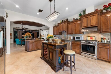 Gas range and stainless steel appliances, center island and breakfast bar