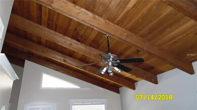 Vaulted natural wood beam ceilings in living area