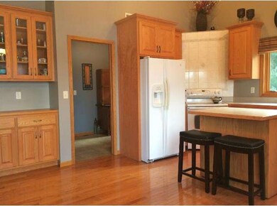 Right off the kitchen, you will find the laundry/m