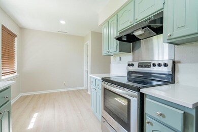 Kitchen featuring light countertops, stainless ste