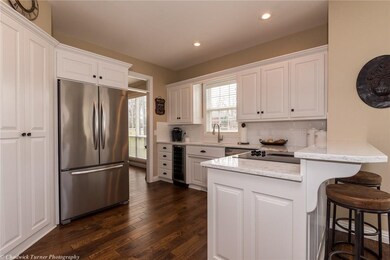 The kitchen was updated with new quartz, reconditioned cabinets, new flooring, and new back splash. 
Fridge does not convey.