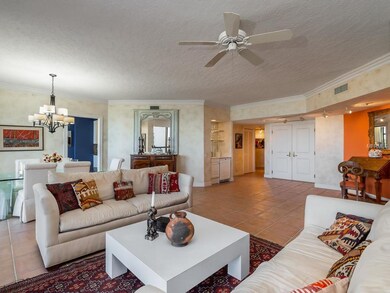 Living room to foyer and wet bar.