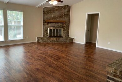 Unfurnished living room with dark hardwood / wood-