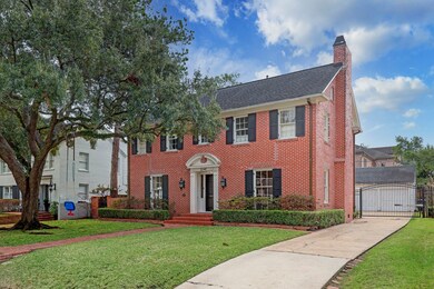 This picturesque home has excellent curb appeal with manicured landscaping and large, mature shade tree!
Notice the wrought iron driveway gate, with room to play behind it!