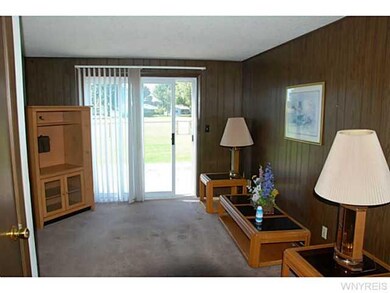 Family Room. Sliding Glass Door leads right out ba