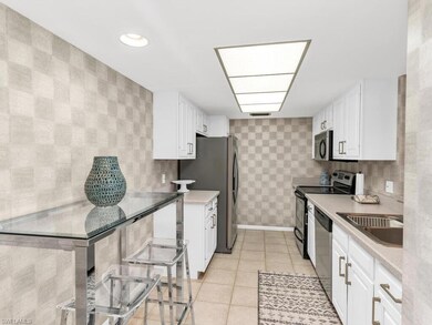 Kitchen with white cabinetry, stainless steel appl