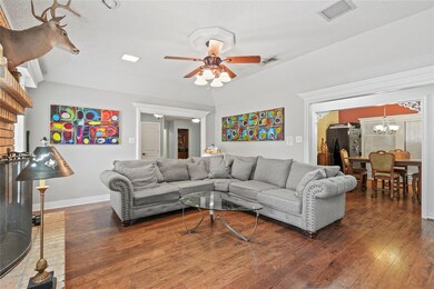 Living room featuring a textured ceiling, ceiling 
