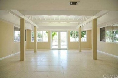 Enclosed Patio, with tile flooring.