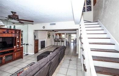 Great room and view thru living room with fireplac
