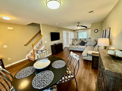 Dining space featuring dark wood-type flooring and