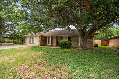 Single story home with a front lawn