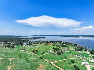 Aerial view of property's location featuring a nearby body of water