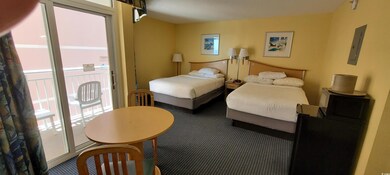 Carpeted bedroom featuring access to outside, elec