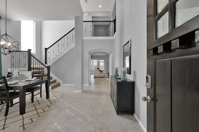 grand entry with lots of natural light due to two story entrance