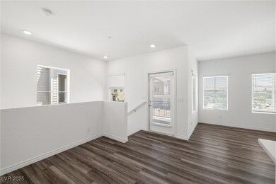 Unfurnished room featuring dark wood-style floorin