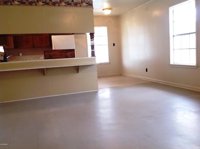 Living Room view of Kitchen and Dining