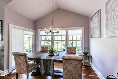 Eat in kitchen area with vaulted ceiling.