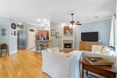 Living Room offers wood floors and open to Kitchen