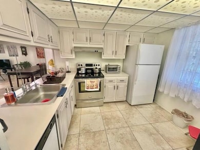 As you enter, kitchen to your right