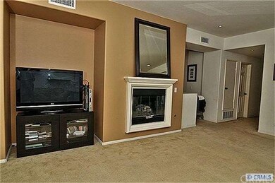 Cozy fireplace and media niche in living room