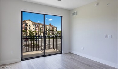 Unfurnished room featuring visible vents, baseboar