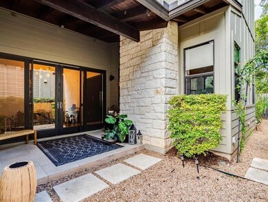 Property entrance with french doors and stone sid