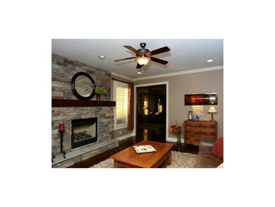 Hearth room is open to the kitchen and casual dini