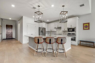 Kitchen featuring appliances with stainless steel