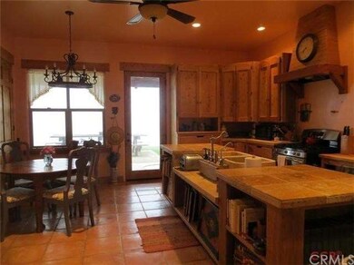 Kitchen & handcrafted cabinetry view from living r