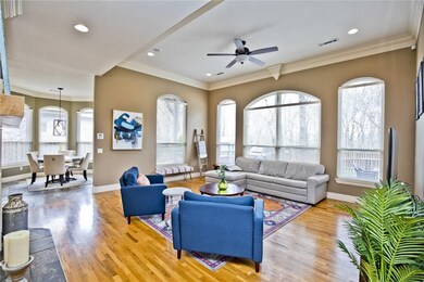 Family room with huge windows that look out to the