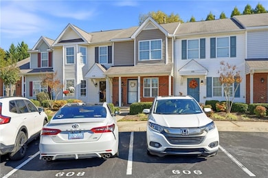 Paved Parking Lot with 2 assigned parking spots & extra visitor spots.