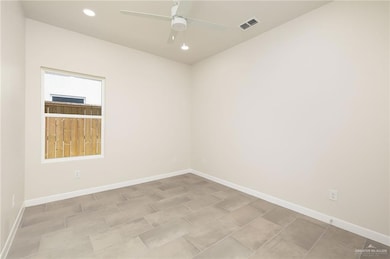 Empty room with recessed lighting and ceiling fan