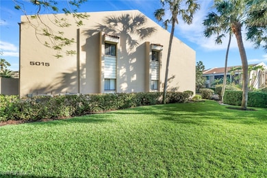 View of property exterior with a yard and stucco siding