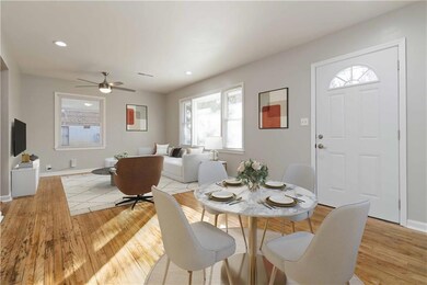 Dining space with baseboards, light wood-style flo