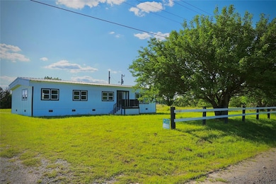 View of front of property with crawl space