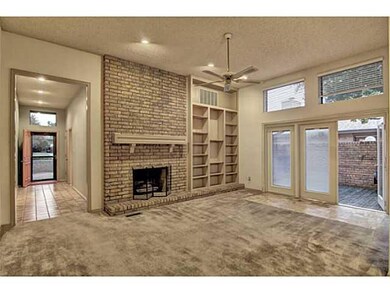 Den/Family/Great Room. Fireplace and open to court