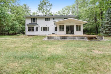 Back of home with large back deck