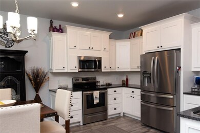 Beautiful cabinets, stainless steel appliances - yes, the new refrigerator will convey.