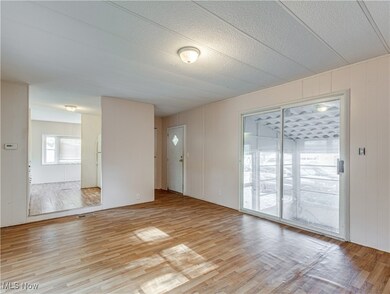 Living room with entrance to screened-in porch